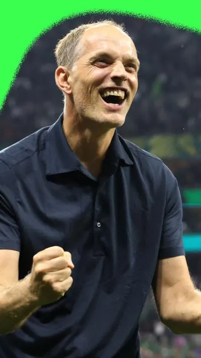 Thomas Tuchel celebrating victory over Mexico. He is wearing a black shirt.